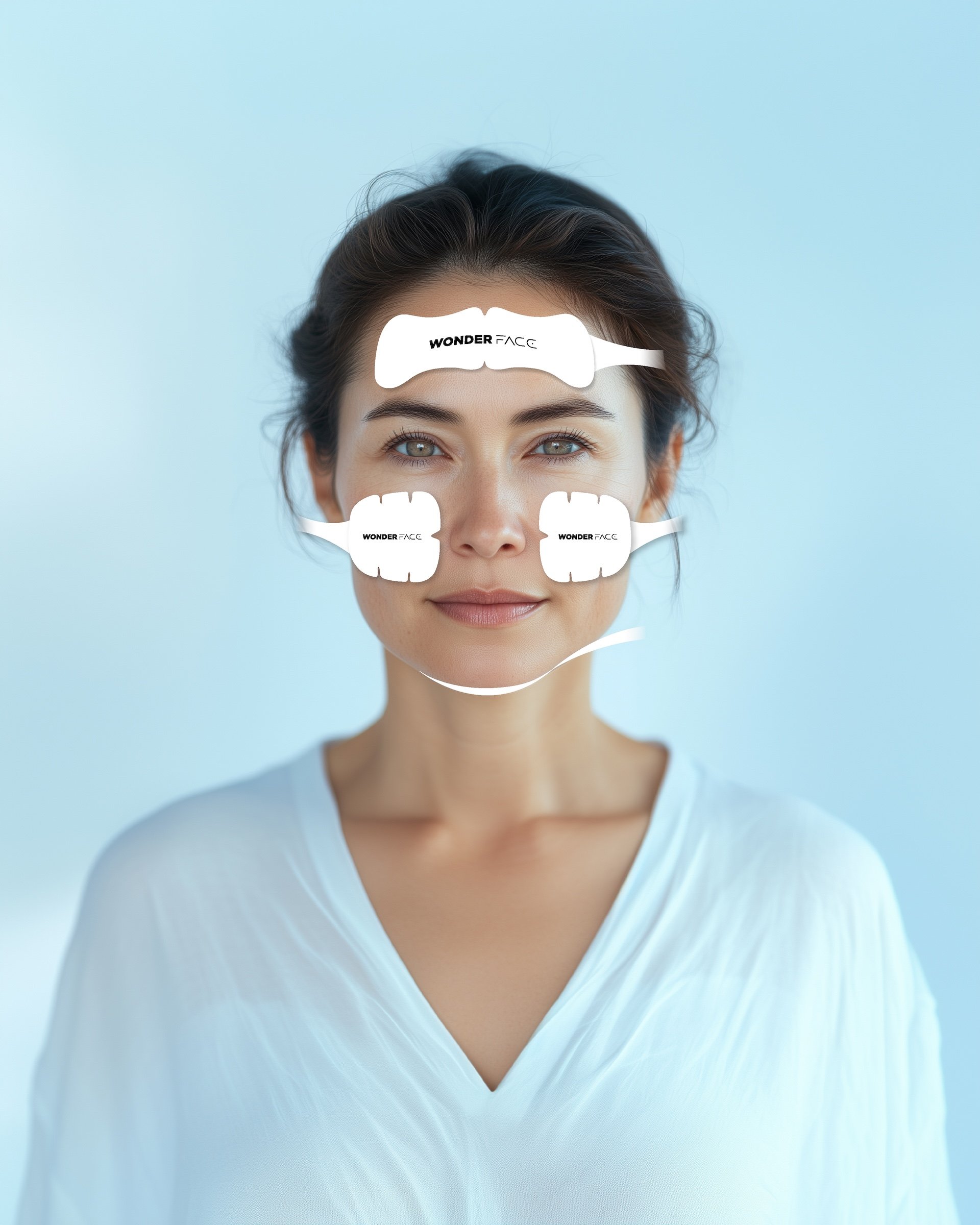 Woman using the Wonder Face facial toning device